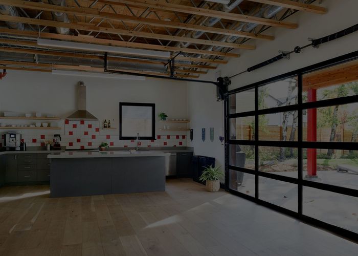 Kitchen island with glass garage doors